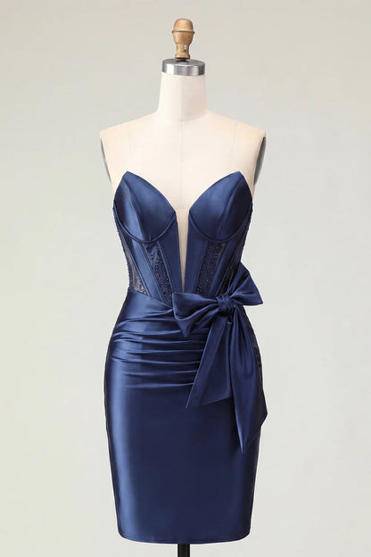 Navy blue strapless dress on a model, showcasing the luxurious satin fabric.