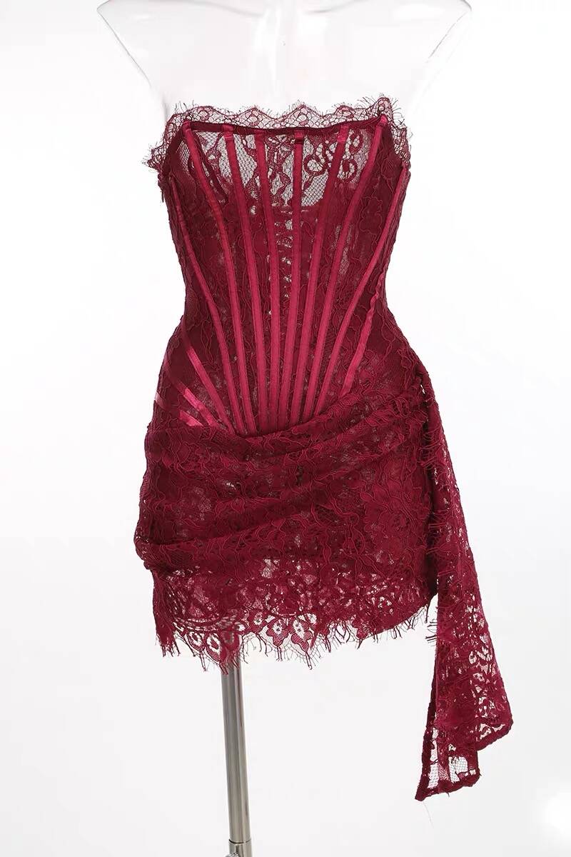 Close-up of sweetheart neckline and intricate lace corset on the Koutun mini dress.