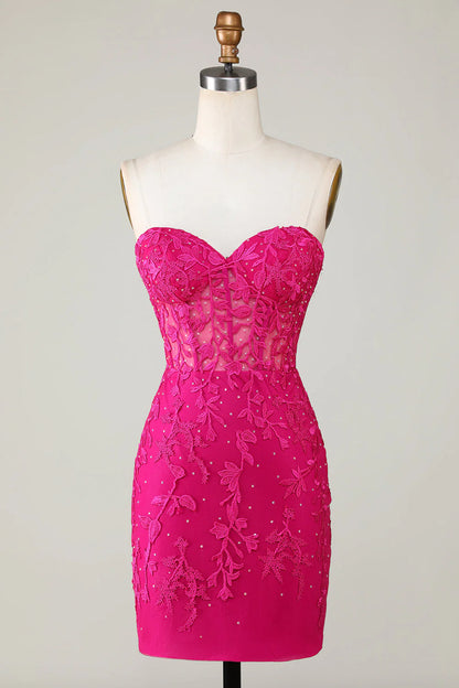 Back view of a bodycon sweetheart corset dress with appliques.
