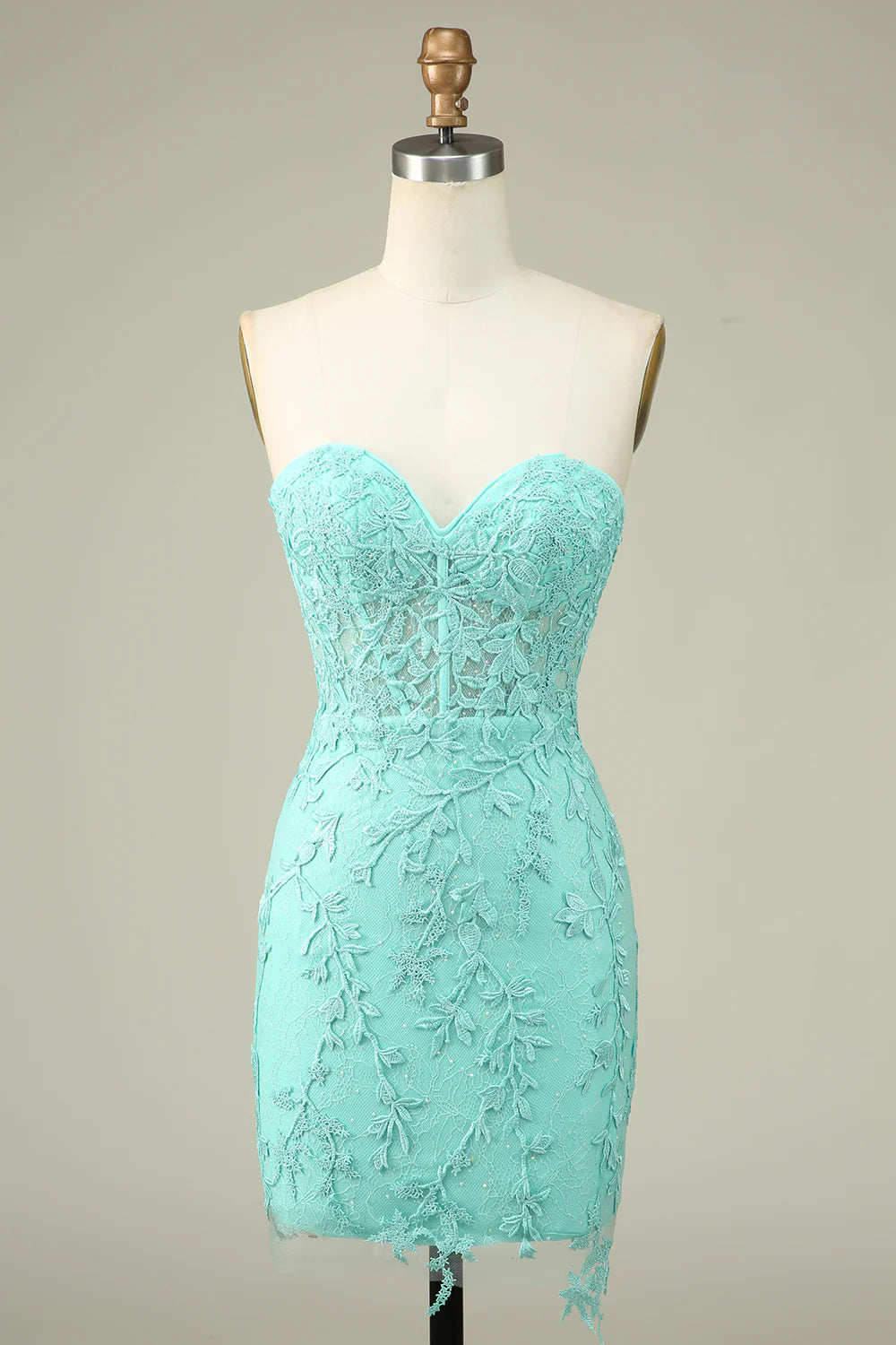 Green bodycon sweetheart corset homecoming dress with appliques.