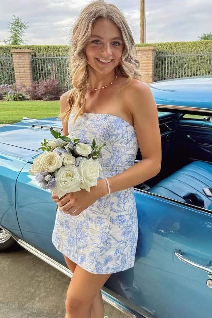 Model wearing a blue floral strapless bodycon short dress.