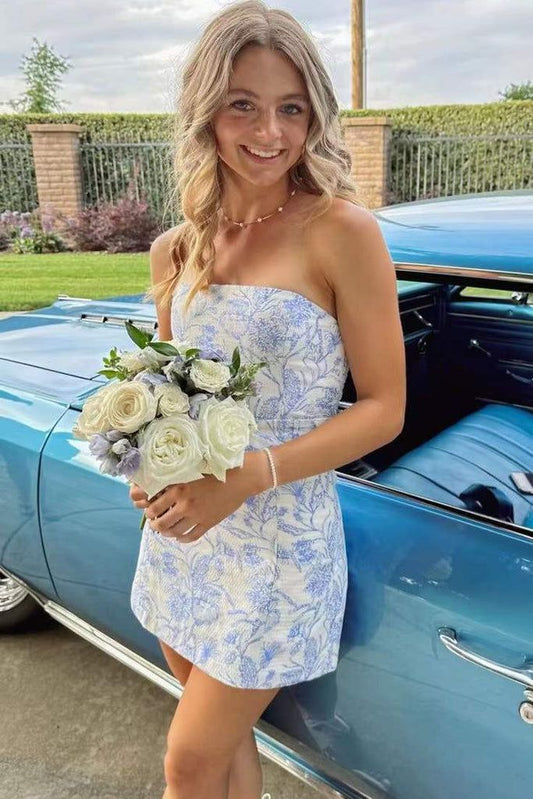 Model wearing a blue floral strapless bodycon short dress.