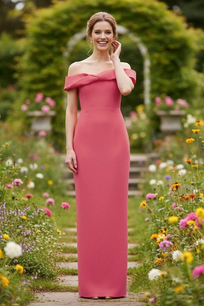 Model wearing an elegant off-shoulder twisted neckline form-fitting floor-length gown with a back slit.