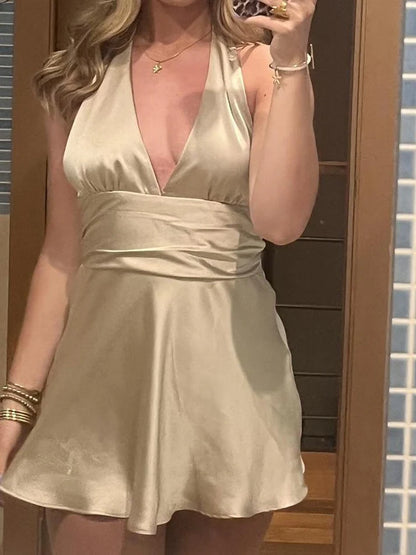 Another angle of the halterneck deep V-neck ruched mini homecoming dress.