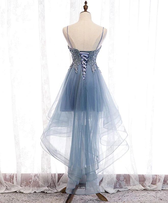 Back view of the blue high-low tulle dress showing lace and flowing skirt.