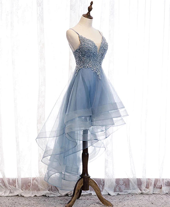 Close-up of the blue tulle dress with V-neckline and delicate lace straps.