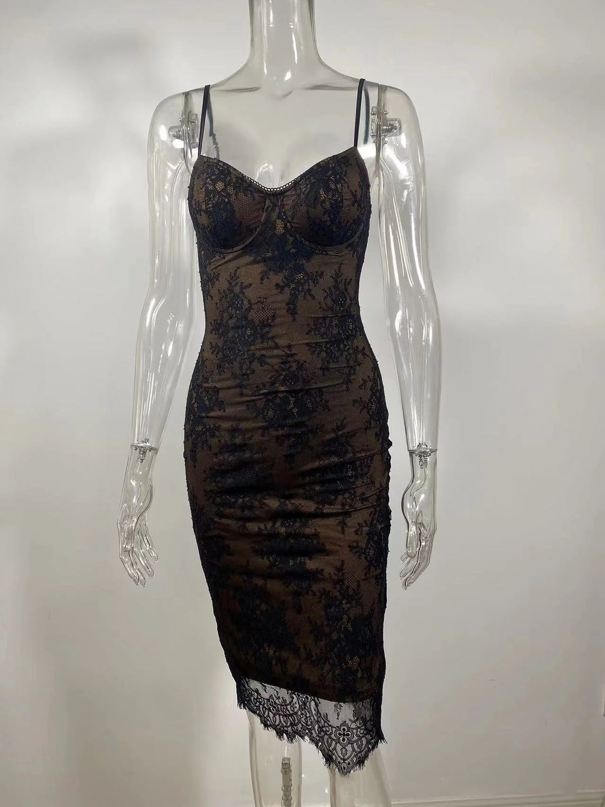 Model in a lace bodycon mini dress, showing movement and fit.