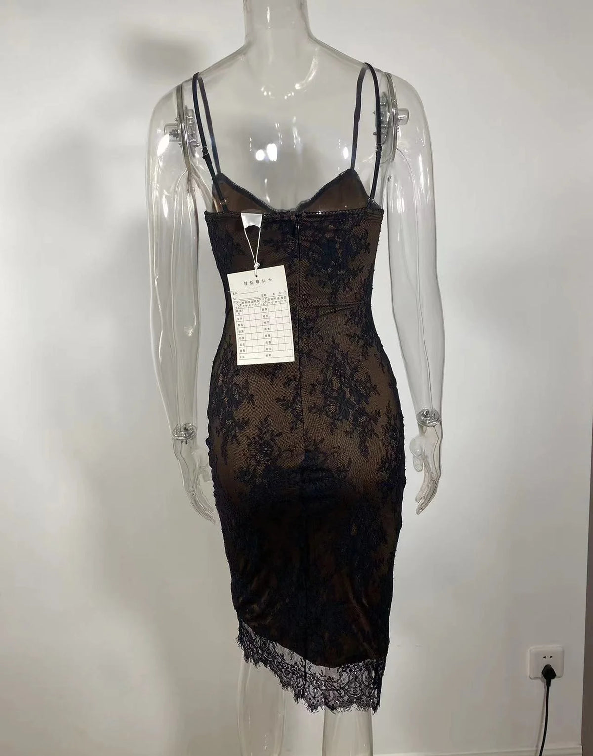 Detailed view of the lace pattern and fabric of the homecoming dress.