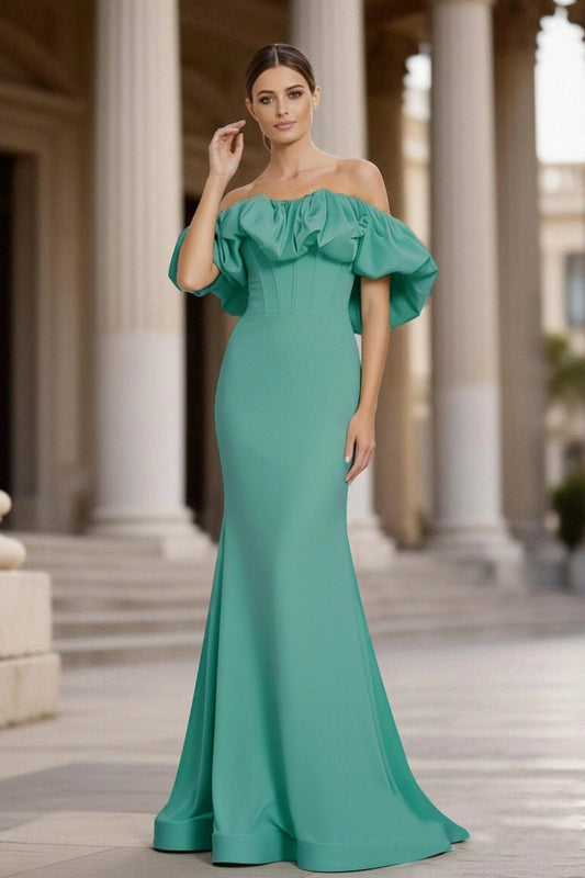 Elegant Koutun off-shoulder ruffled mermaid gown in a formal setting.