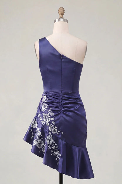 Model in the navy blue dress, showing the fabric's subtle sheen and movement.