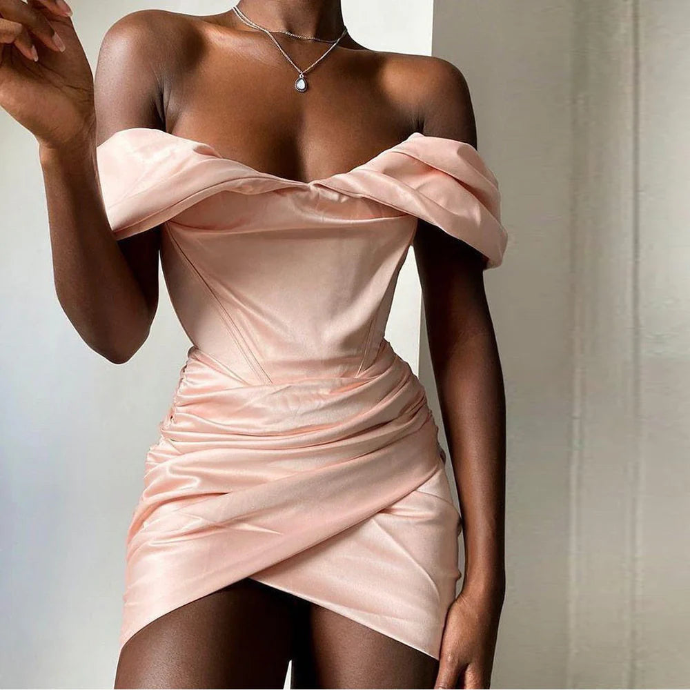 Close-up of the smooth satin fabric on the off-shoulder mini dress.