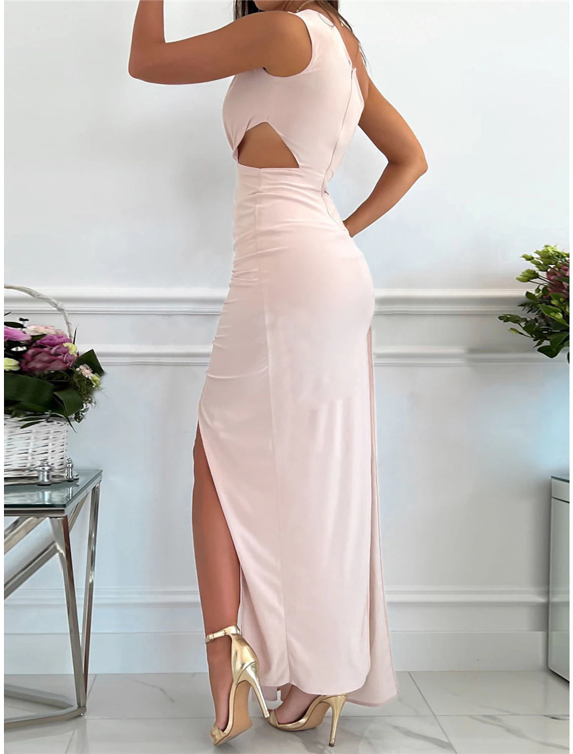 Woman wearing a red one-shoulder formal gown.