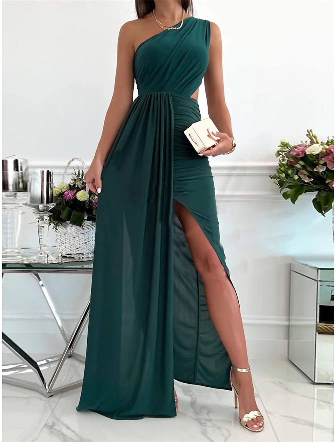 Back view of the sleeveless maxi dress with backless design.