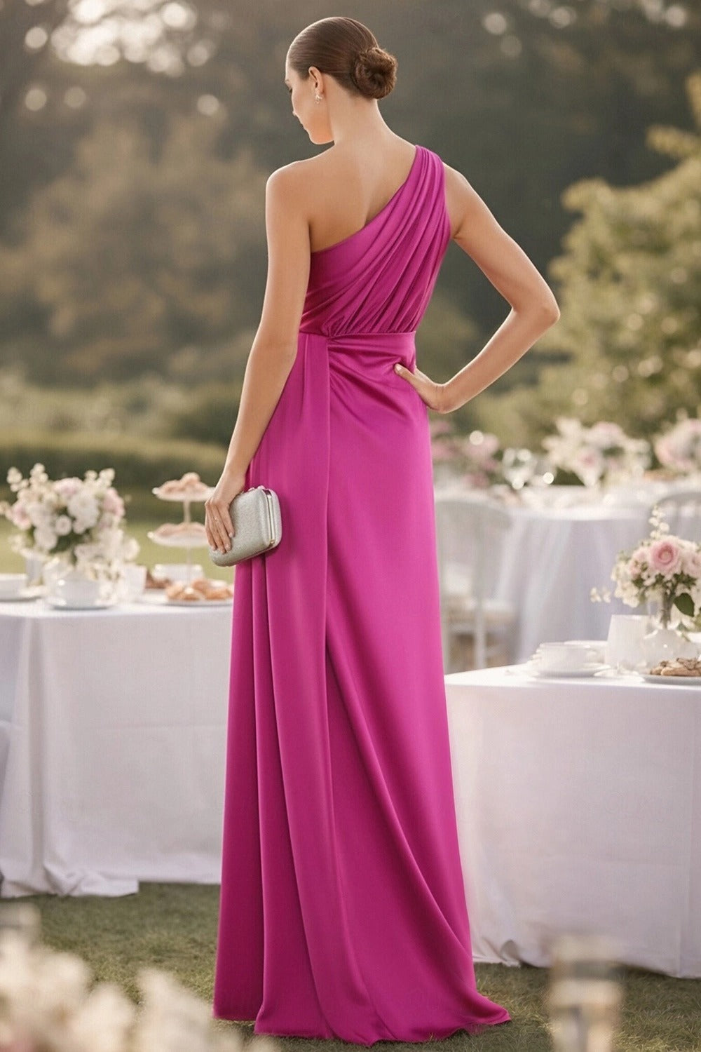 Back view of the Koutun one-shoulder draped satin formal dress, showcasing the floor-length skirt.