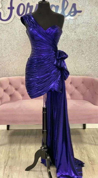 Model posing in the vibrant green one-shoulder homecoming dress, full length.