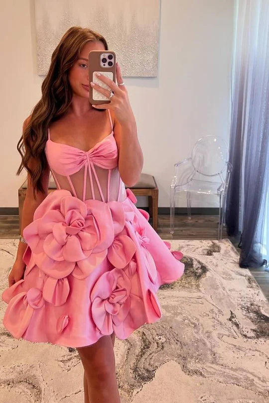 Close-up of floral details on a pink satin homecoming dress.