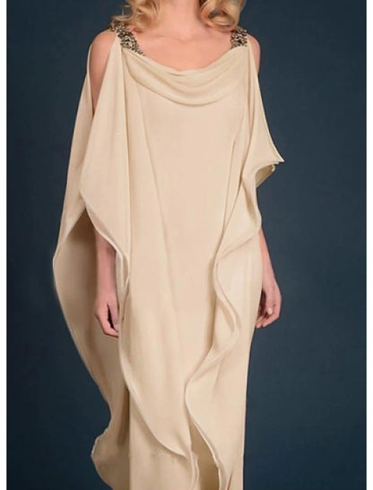 Elegant plus size woman in a dark jewel neck chiffon gown with half sleeves and beading.