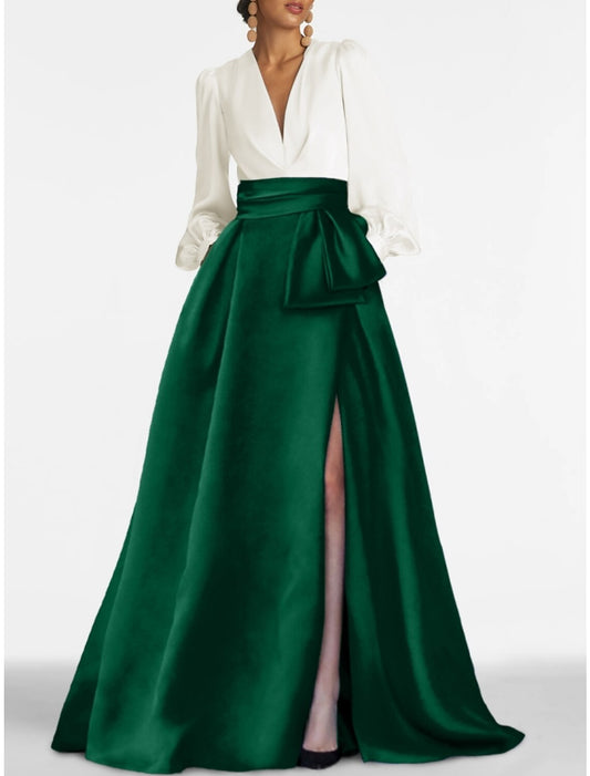 Woman in elegant red A-line satin evening gown with V-neck and long sleeves.