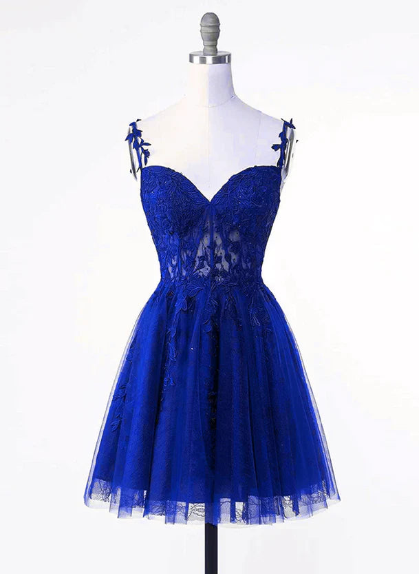 Front view of a royal blue short homecoming dress with tulle skirt and lace applique bodice.