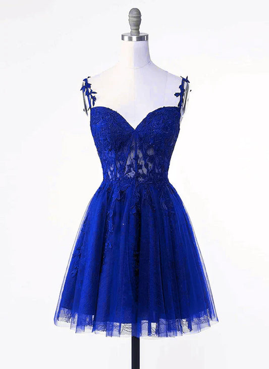 Front view of a royal blue short homecoming dress with tulle skirt and lace applique bodice.