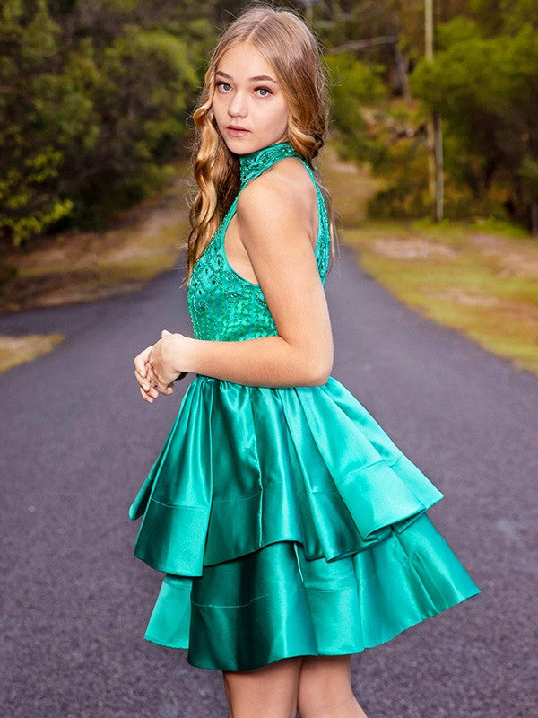Model wearing a short A-Line satin homecoming dress.