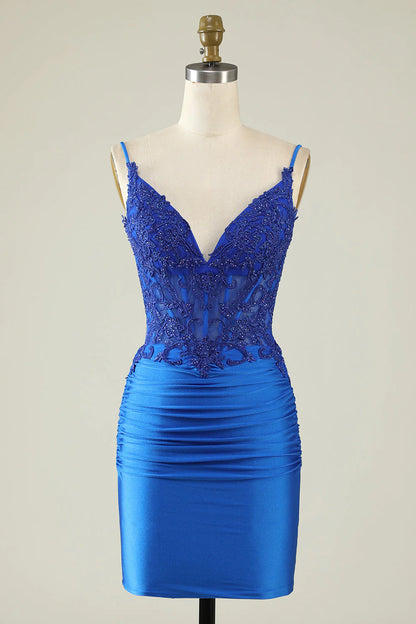 Model wearing a royal blue sheath dress with spaghetti straps and beading.