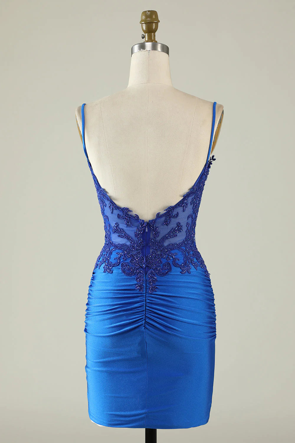Back view of a royal blue sheath dress with spaghetti straps.