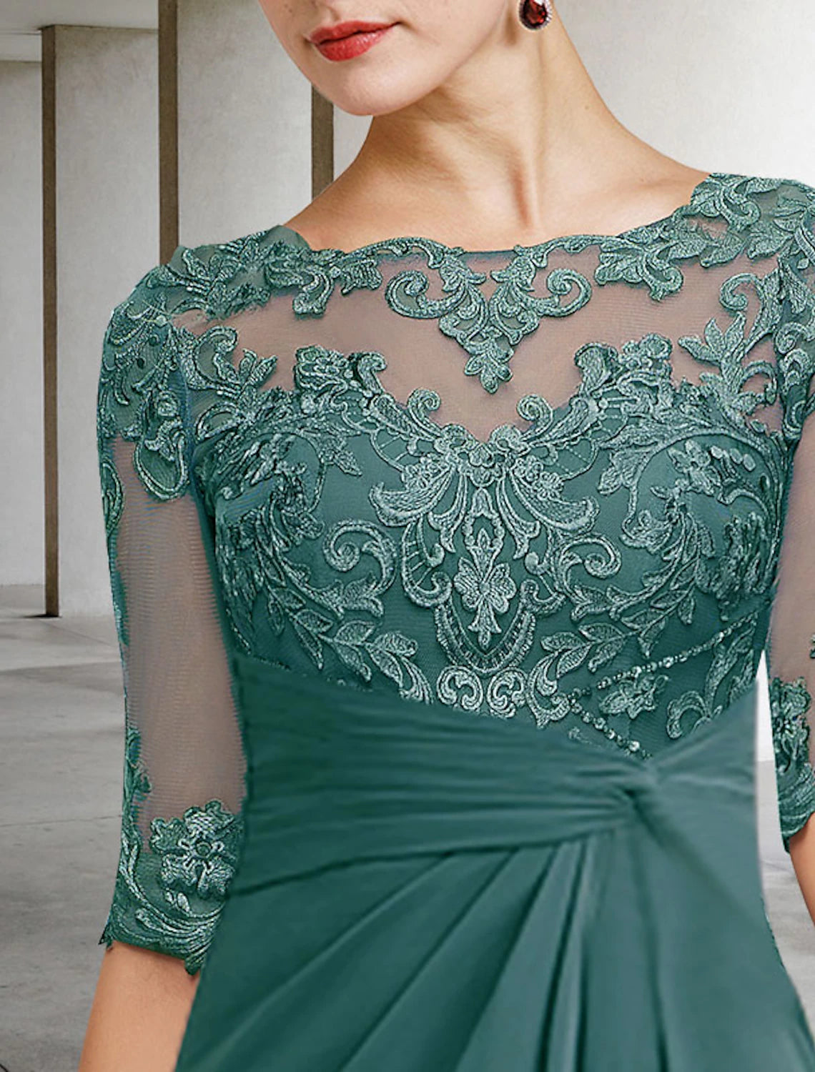 Side profile of the navy chiffon lace dress, highlighting the side-draped detail.