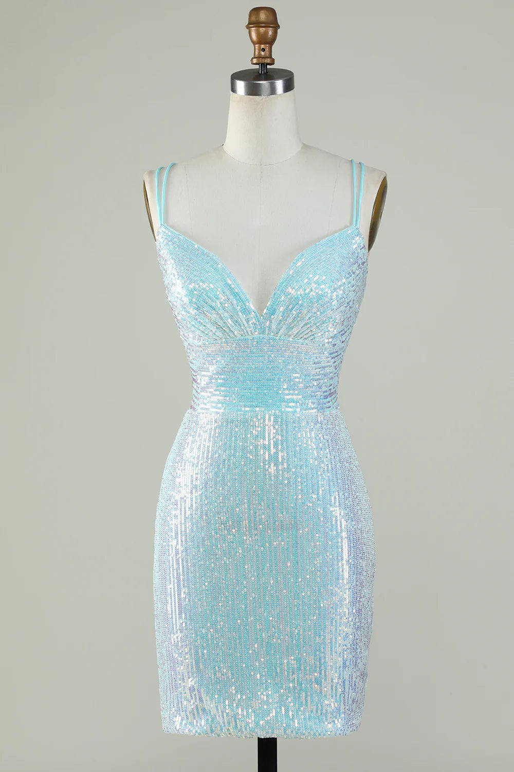 Light blue sequin sheath homecoming dress with spaghetti straps and criss-cross back.