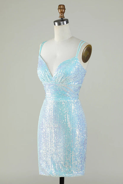 Side profile of model wearing light blue sequined sheath dress.