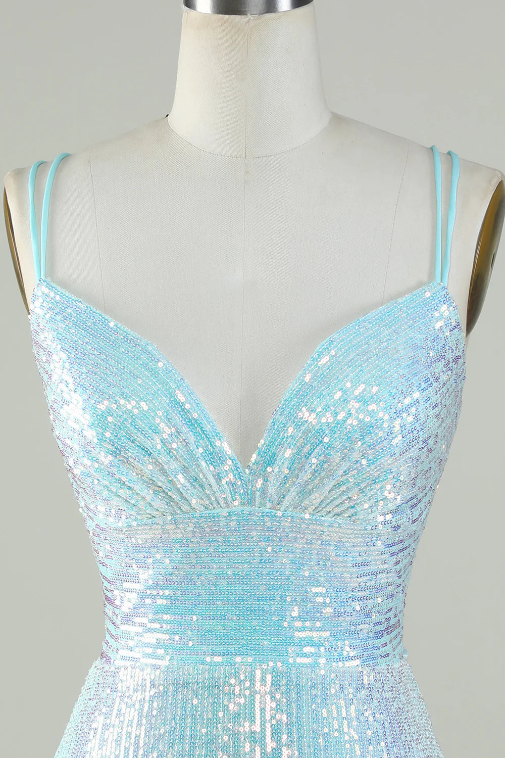 Close-up of light blue sequin fabric on a homecoming dress.
