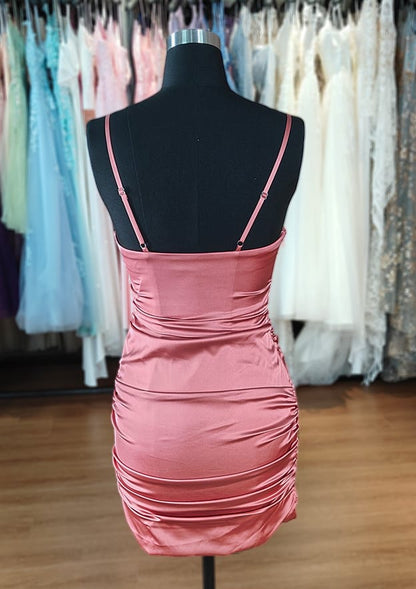 Close-up of the square neckline and satin fabric on the mini dress.