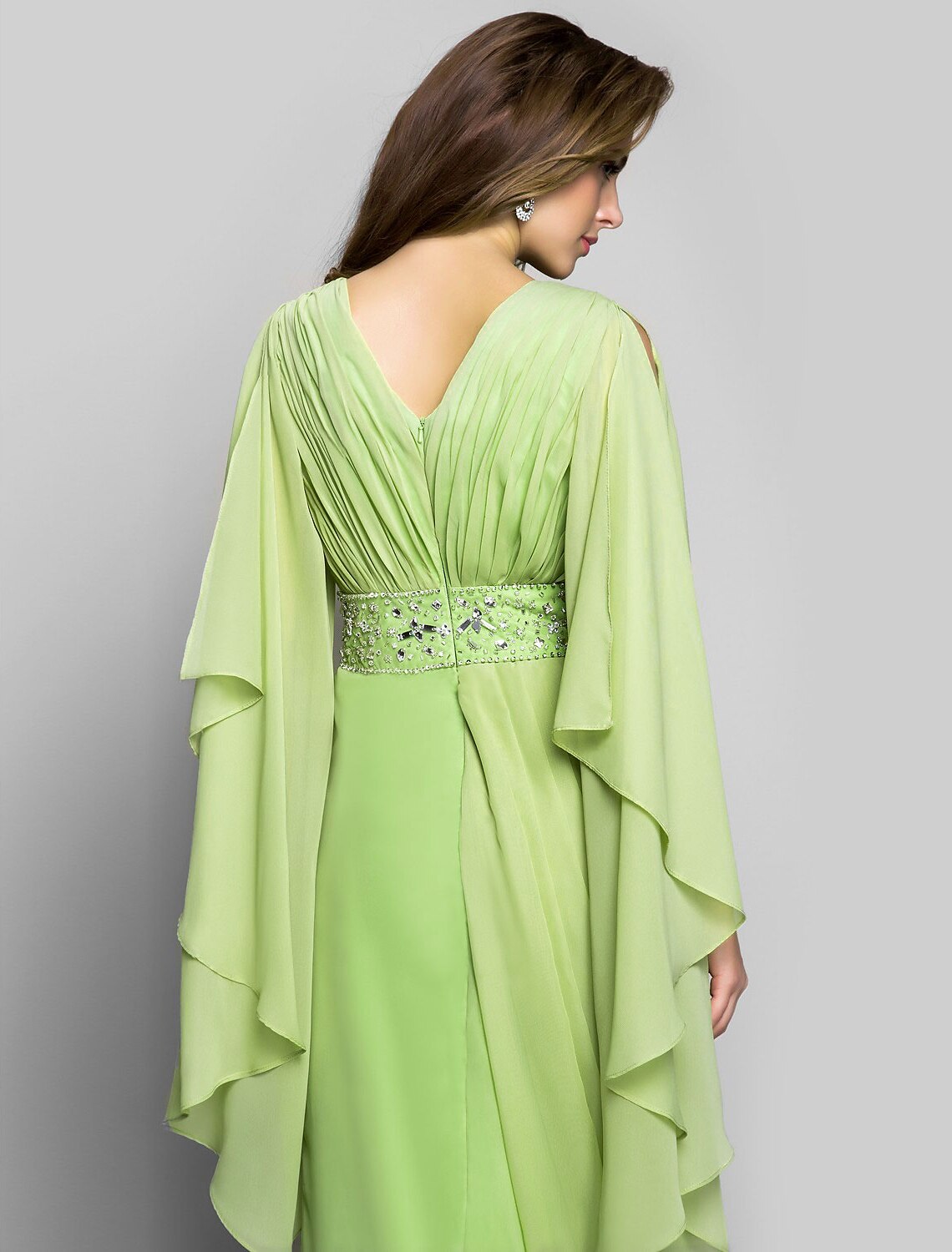 Back view of the elegant gown, highlighting the V-back and silhouette.