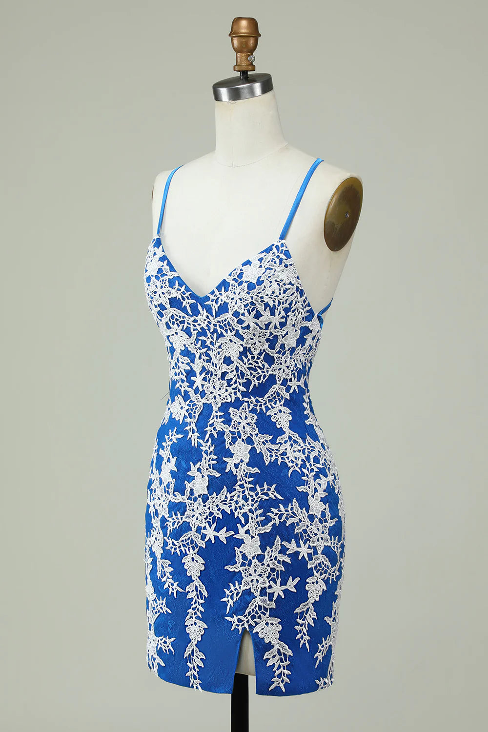 Back view of a blue formal dress with delicate spaghetti straps and appliques.