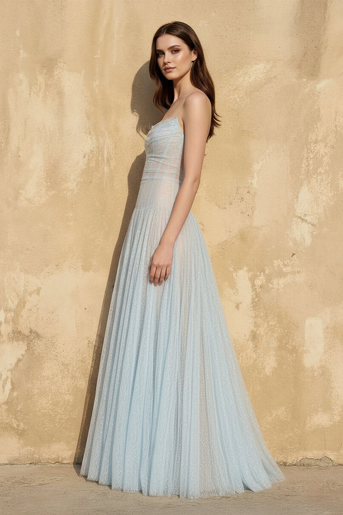 Close-up of the glitter tulle fabric and corset bodice details on the formal gown.