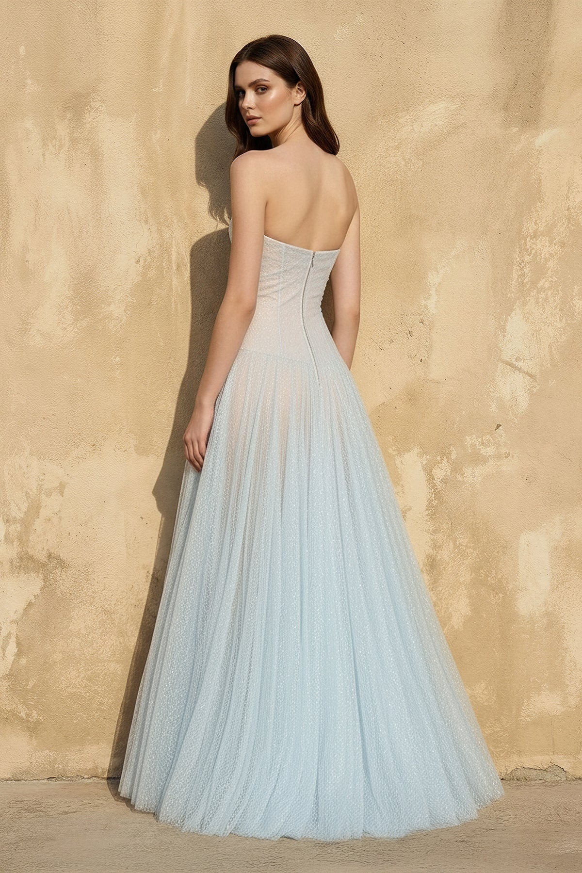 Side view of the A-line glitter tulle gown, highlighting its silhouette.