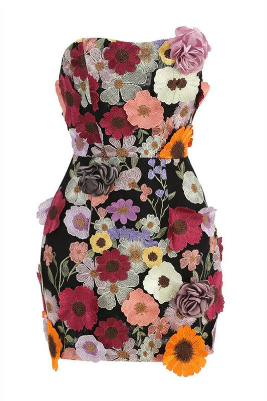 Model wearing Koutun strapless pink bodycon dress with 3D floral embroidery.