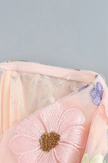 Full view of Koutun pink strapless dress with 3D floral embellishments.