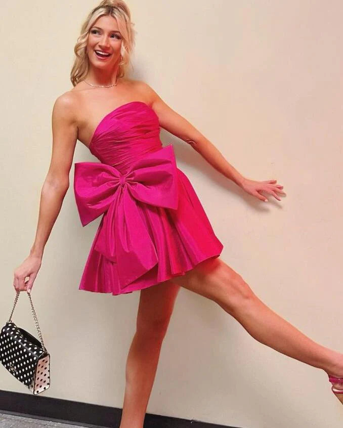 Fuchsia strapless satin pleated mini homecoming dress.