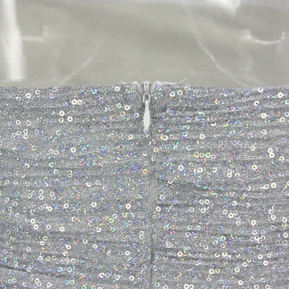 Back view of the silver grey short dress, highlighting its elegant silhouette.