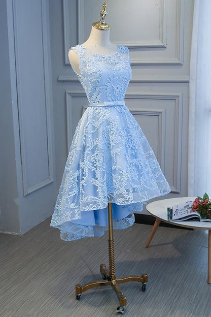 Side view of a fashionable blue high-low dress.