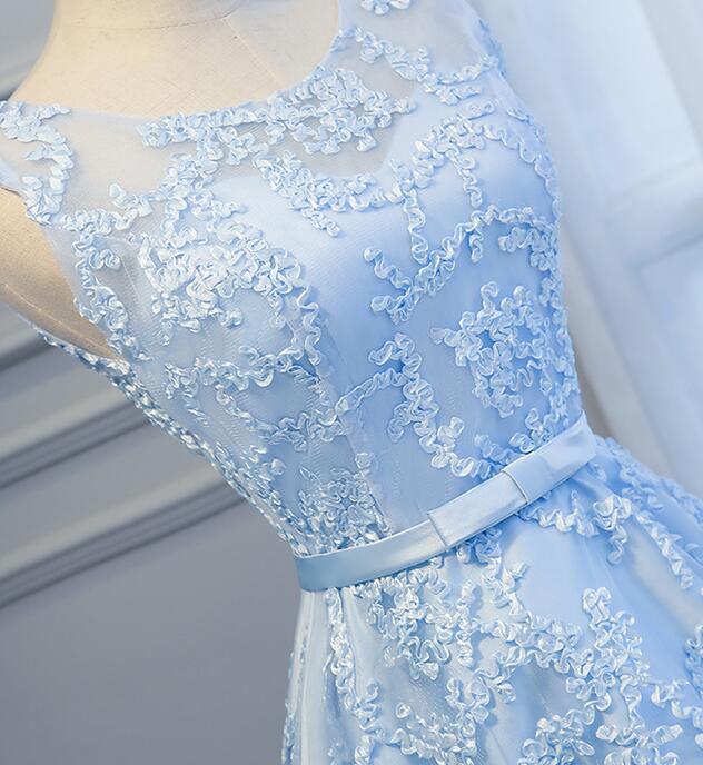 Blue high-low dress with flowing skirt detail.
