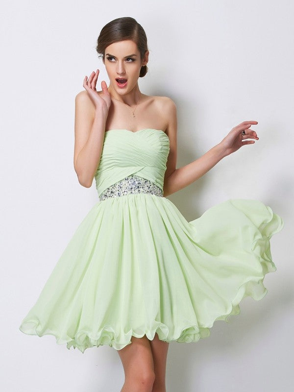 Elegant A-Line sweetheart short homecoming dress with intricate beading.