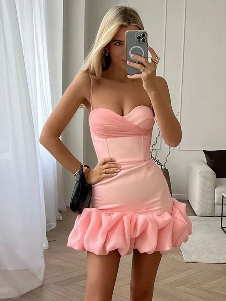 Side profile of a short homecoming dress.