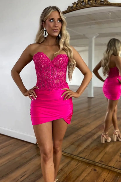 Close-up of beaded corset detail on fuchsia dress.