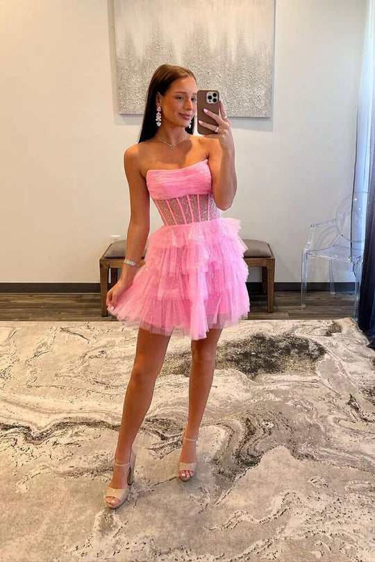 Back view of pink tiered strapless A-line homecoming dress.