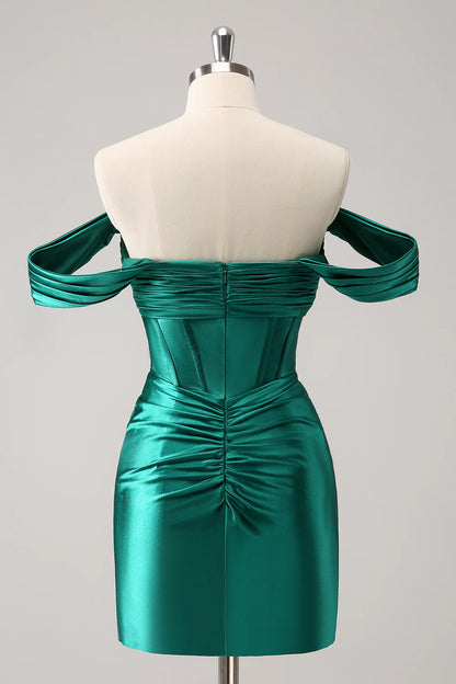 Side view of a model in a dark green off-shoulder satin dress.