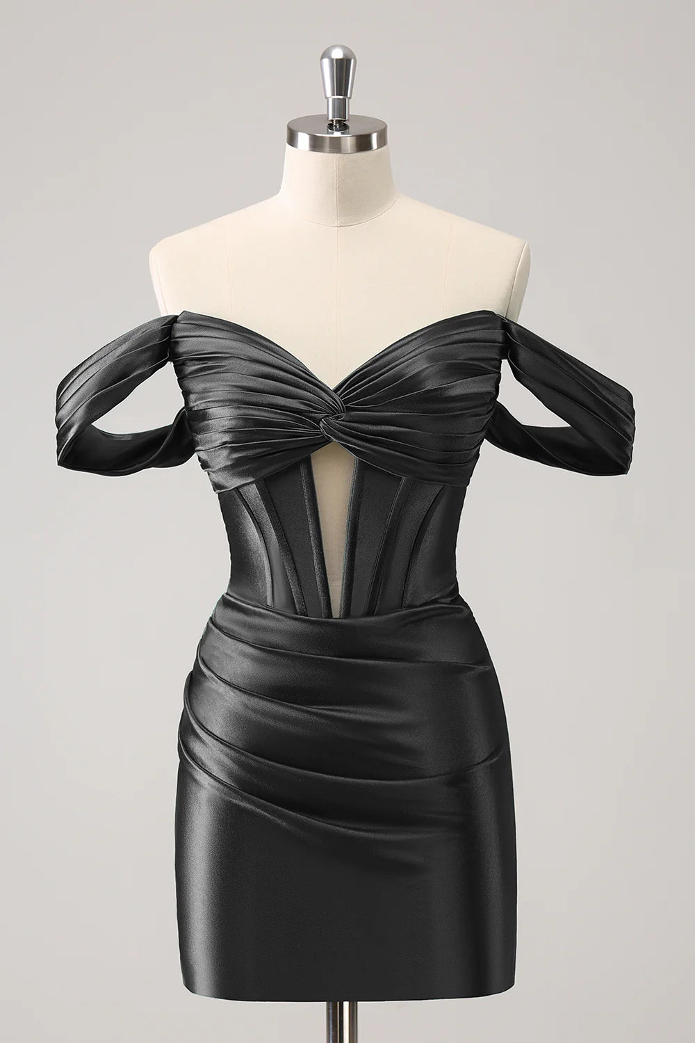 Close-up of the off-shoulder neckline and corset detail on the dark green dress.
