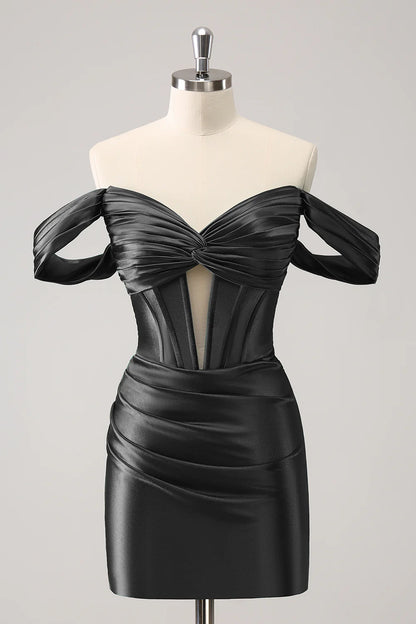Close-up of the off-shoulder neckline and corset detail on the dark green dress.