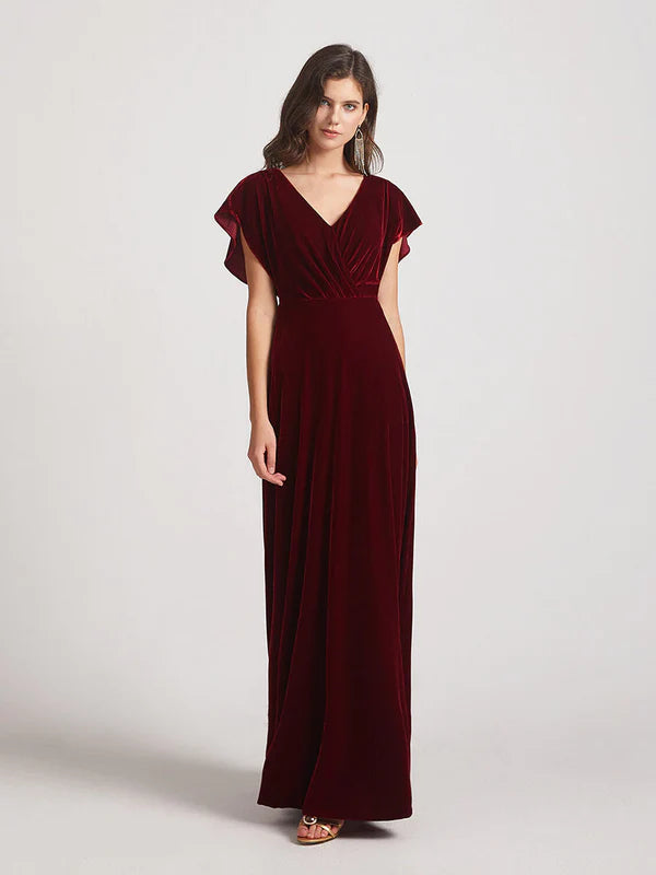 Close-up of the flutter sleeves and velvet fabric on the bridesmaid dress.